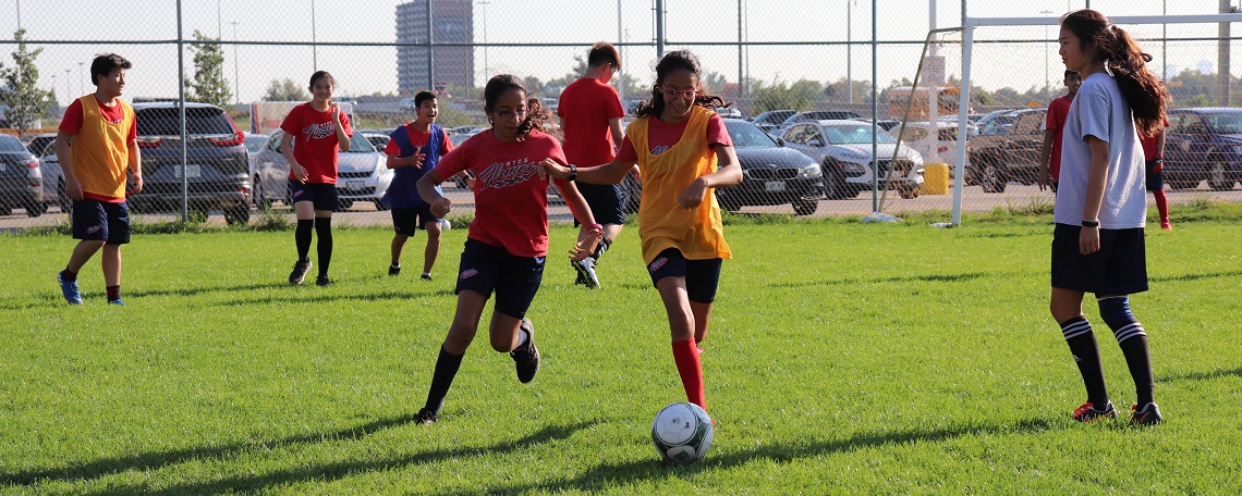 Students playing soccer